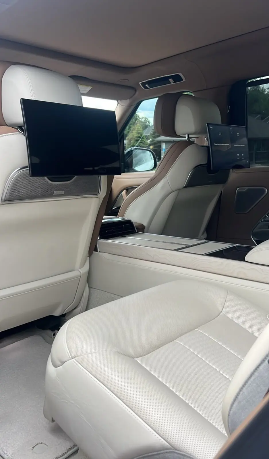 Executive chauffeur cabin with reclining seats and screens