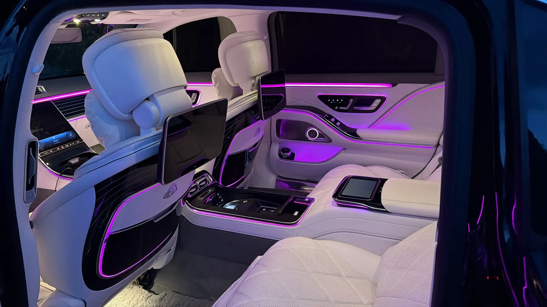 Maybach rear cabin with ambient lighting and entertainment screens