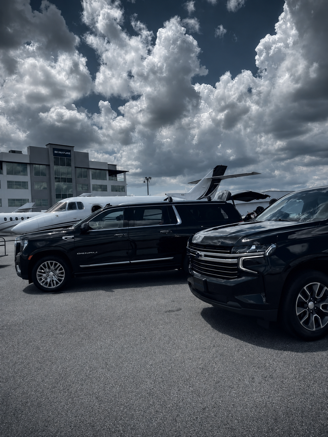 Black luxury SUVs waiting at a private terminal
